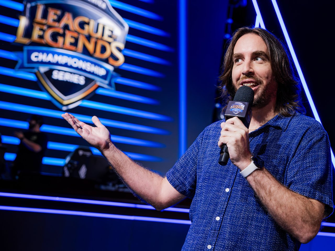 Travis Gafford hosting on stage at the League of Legends Championship Series