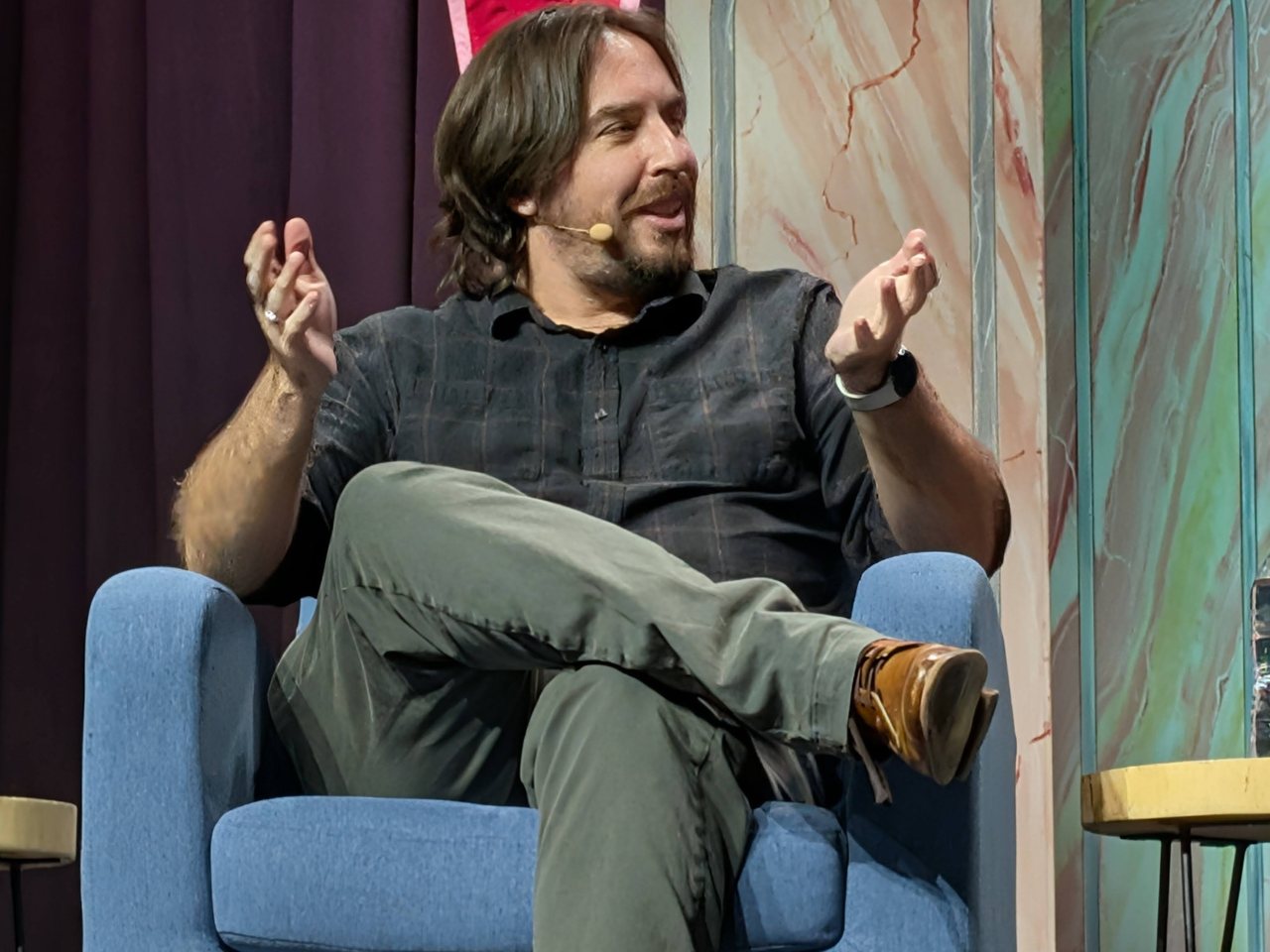 Travis Gafford speaking on stage